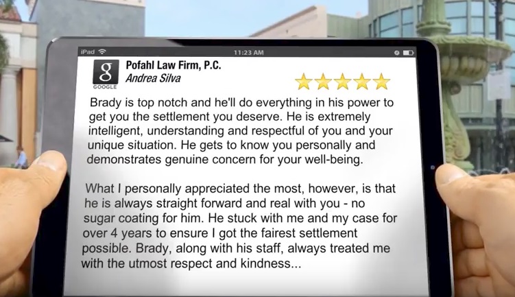 A person holding an iPad reading a five star review of Pofahl Law Firm, P.C. for a job well done on another car accident case.