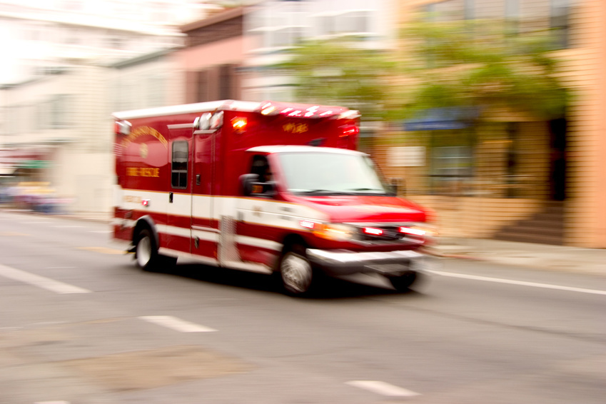 a speeding red ambulance